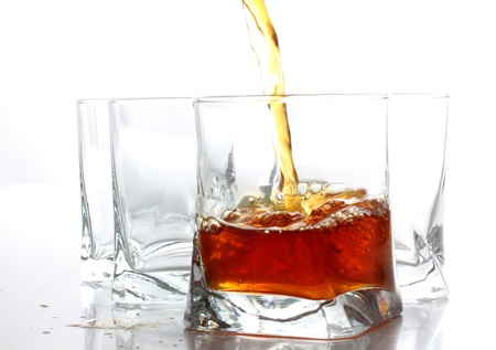 Color photo of glass with whiskey shotsの写真素材