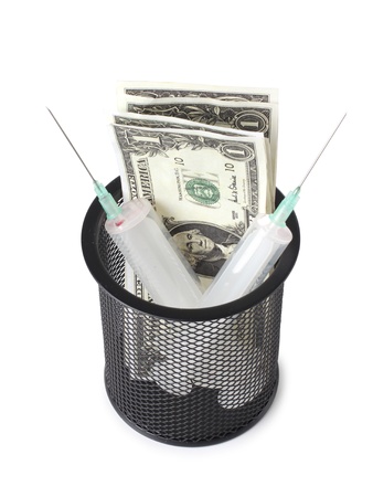 Color photo of a medical syringe and paper moneyの写真素材