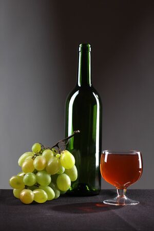 Color photo of a glass of wine and grapesの写真素材
