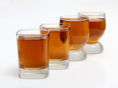 Color photo of glass with whiskey shotsの写真素材