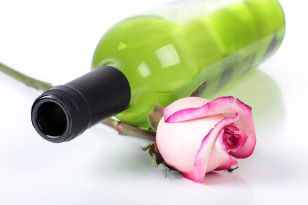 Color photo of a bottle of wine and rosesの写真素材