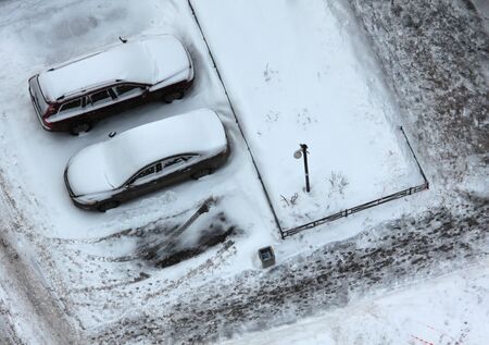 Color photo of cars on the road in the snowの写真素材