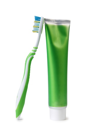 Color photo of a tube of toothpaste and a toothbrushの写真素材