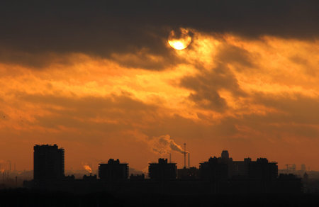 Urban industrial building on background of dawnの写真素材