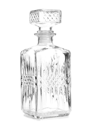 Glass decanter of whiskey on white backgroundの写真素材