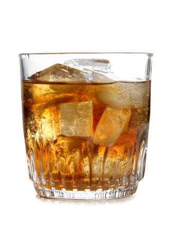 Glass cup of whiskey on white backgroundの写真素材