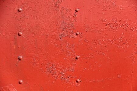Rusty iron wall covered with paintの写真素材