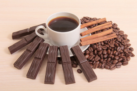 Coffee cup and chocolate on wood backgroundの写真素材
