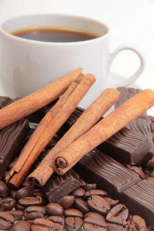 Coffee cup and chocolate on a white backgroundの写真素材