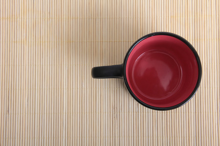 Coffee beans and a white cup on tableの写真素材