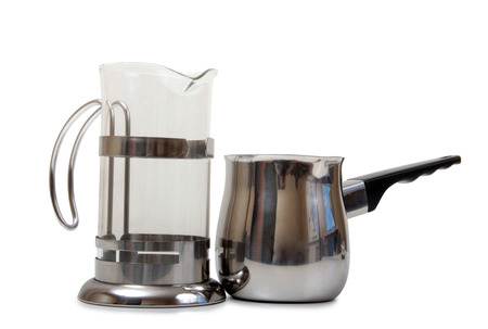 Metal and glass pots for coffee on a white backgroundの写真素材
