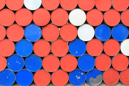 Large metal barrels stacked in a rowの写真素材