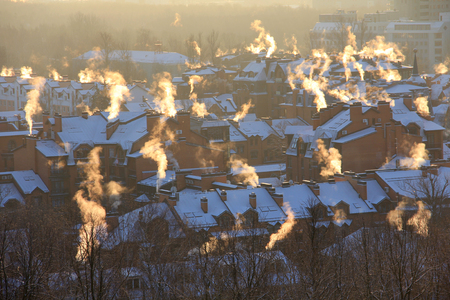 Smoke from industrial chimneys at dawnの写真素材