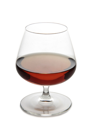 Glass with brandy and cognac on white backgroundの写真素材