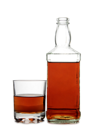 Glass with brandy and cognac on white backgroundの写真素材