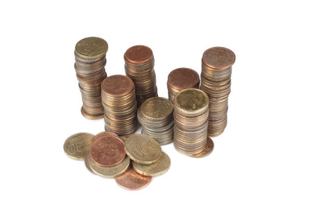 Large stack of coins on a white background