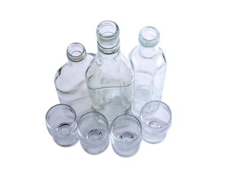 Empty glasses bottles on white backgroundの写真素材