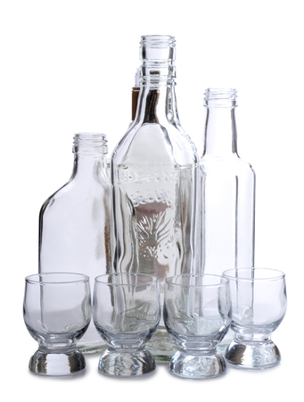 Cocktail in a glass and bottles on white backgroundの写真素材