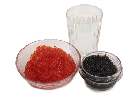 Fish caviar and glass of vodka on white backgroundの写真素材