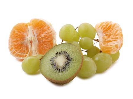 Sliced ??pieces of raw fruit on white backgroundの写真素材