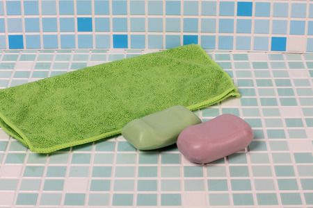Accessory of hygiene and perfumery on the tile in the bathroomの写真素材