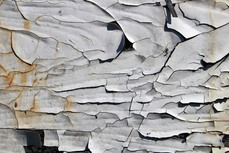 Old wooden wall covered with paintの写真素材
