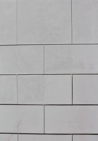 Old stones wall covered with paint