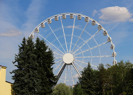 Big ferris wheel in an amusement park on a sky backgroundの写真素材