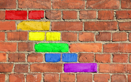 Rainbow pattern on an old brick wall