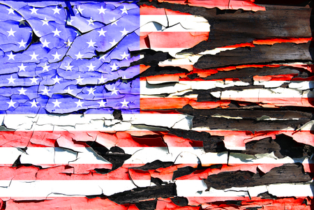 American flag on a burnt wooden boardの写真素材