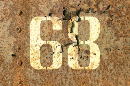 Sixty eight on a metal detail of a military machineの写真素材