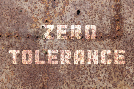 Zero tolerance on an old dirty wallの写真素材