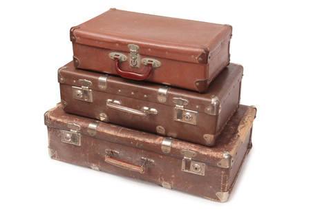 Ancient suitcase for travel on a white backgroundの写真素材