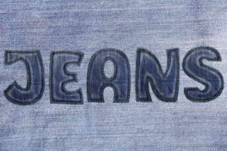 Denim wild west letters on old jeans background. vintage poster