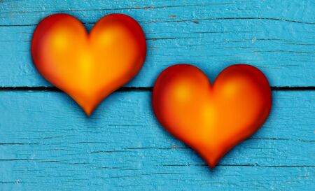 Red hearts on an old blue wooden board. Symbol of love and Valentine's Dayの写真素材