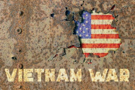 American flag and inscription Vietnam war on rusty armor of a military vehicleの写真素材
