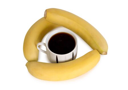 Ripe yellow banana and cup of coffee on white background. Ingredients for cookingの写真素材