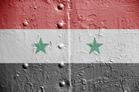 Flags of Syria on metal wall. Background on topic of international conflictの写真素材