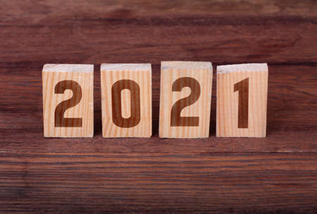 Wooden block with numbers 2021. Concept of beginning of new yearの写真素材