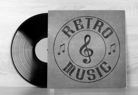 Vintage vinyl discs on wooden background