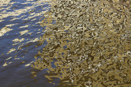 Water surface in bright sunlight. Abstract background for decor