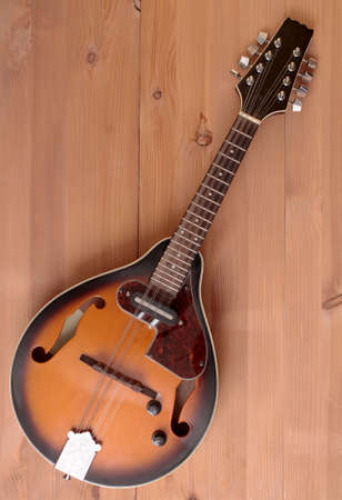 Vintage country mandolin on wooden backgroundの写真素材