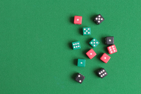 Red dice on green cloth. Items for gamblingの写真素材