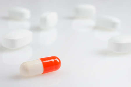 Pharmacy theme, white and red medicine tablets antibiotic pills.の写真素材