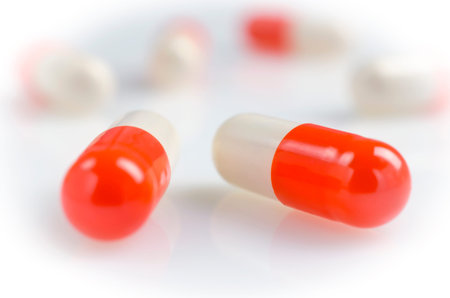 Pharmacy theme, white and red medicine tablets antibiotic pills.