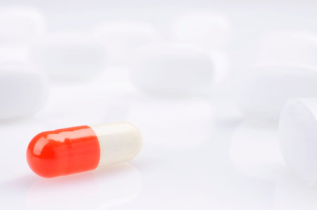 Pharmacy theme, white and red medicine tablets antibiotic pills.の写真素材