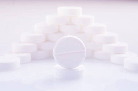 Wall of white tablets on a light surface