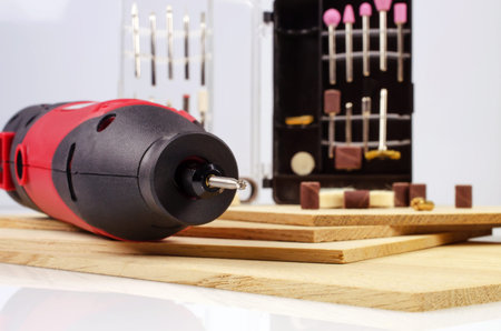 Engraving machine and accessories are on the thin oak the boards