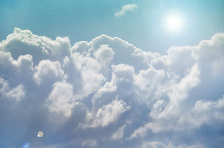 Bright Sun Shines Among The Dark Clouds. Lens Flare.の写真素材