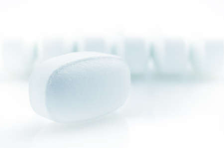 Closeup. Pharmacy theme. White Pills on the White Backgroundの写真素材